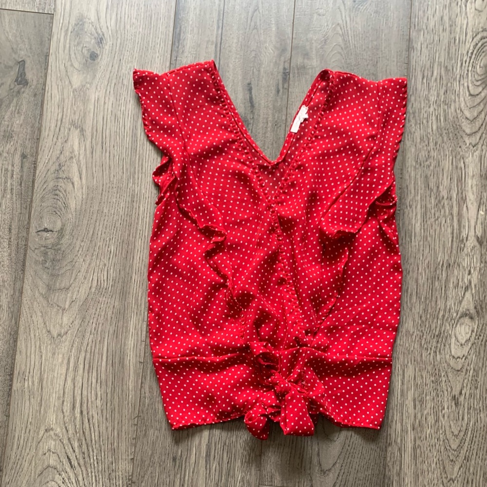 Red polka dot sleeveless blouse